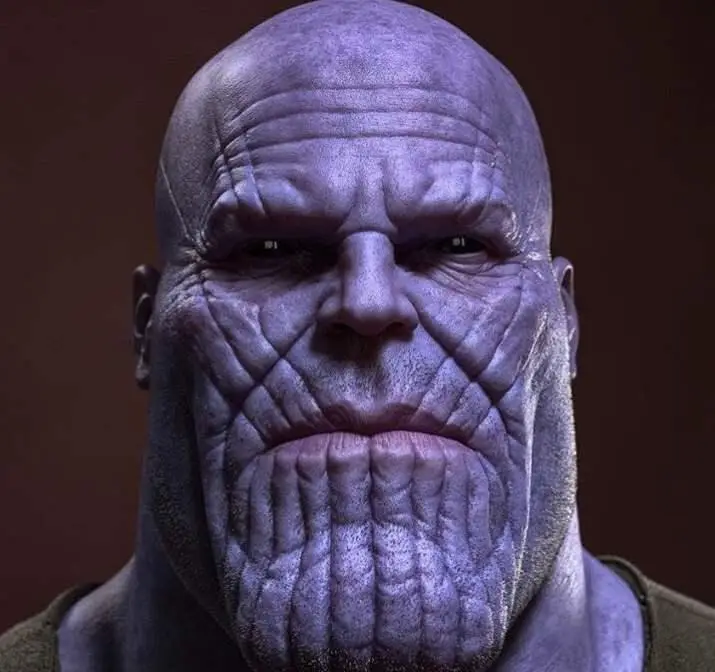 The character Thanos from the Marvel movies,he is weird looking with lots of lines on his face and a big head and small eyes.